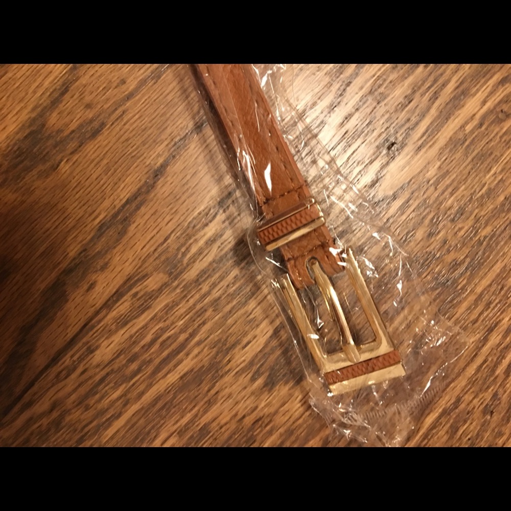 Brown color faux leather belt with golden material